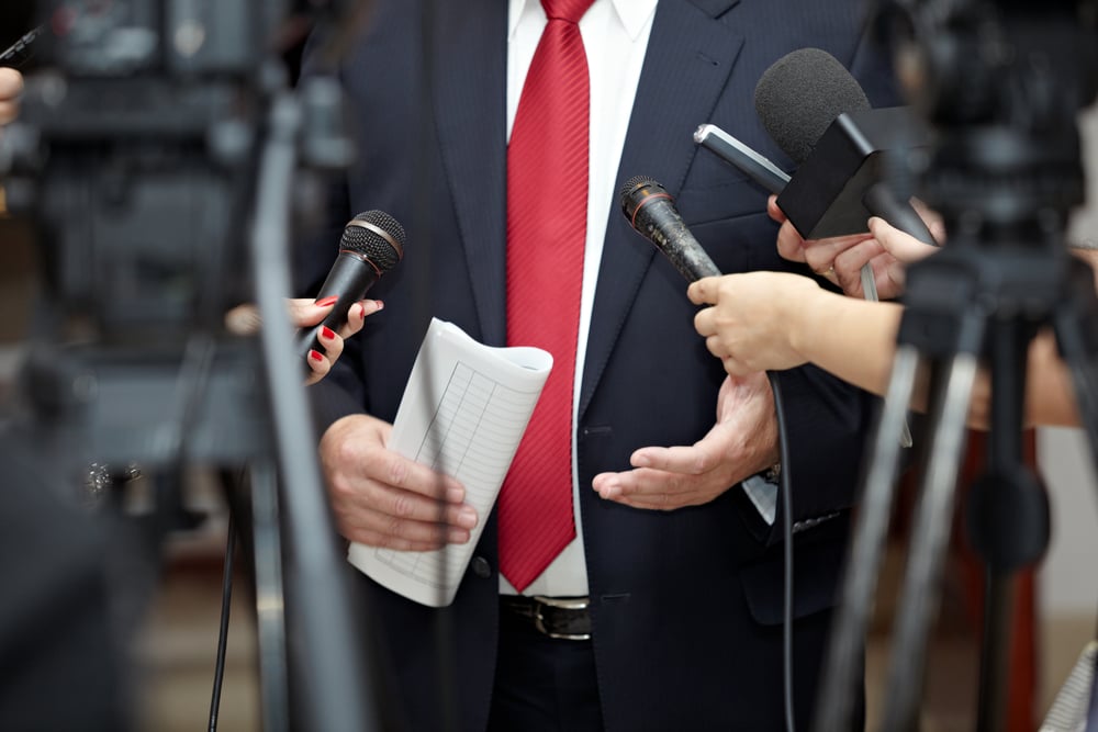 close up of conference meeting microphones and businessman-1